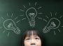 little-girl-with-light-bulb-on-the-blackboard-background-SBI-301985417-scaled